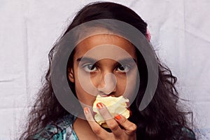 A girl child eating apple