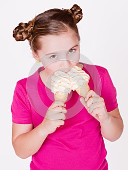 Girl child holding a delicious two white vanilla ice-girl Child holding a delicious two white vanilla ice-creams