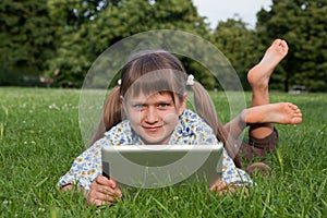 Girl child holding tablet wireless computer rel