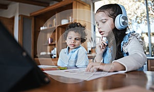 Girl child, homework and thinking with headphones, music or little brother at desk in family home. School kids, study or