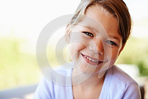 Girl, child and laugh in portrait at house for development, growth or maturing or holiday. Female kid, smile and family