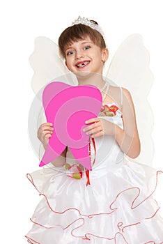 Girl child lost tooth fairy dressed in white gown with wings show big tooth shape made from paper