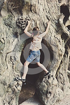 Girl child outdoors climb tree