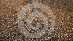 Girl child playing classics hopscotch game in the park. childhood kid dream concept. little girl jumping on the squares