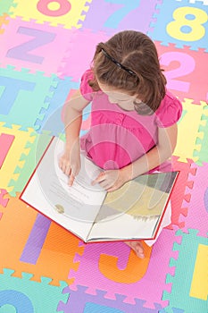Girl child reading kids book