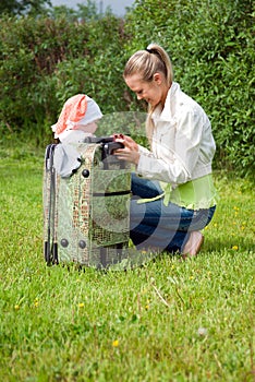 Girl and child in valise.family to journey