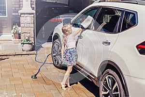 girl child washing cleaning car