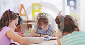 Girl children, group and pencil in classroom, school and happy for learning, education and development. Female kids