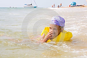 Girl choked and hit the water in the nose, while she was bathing in the sea photo