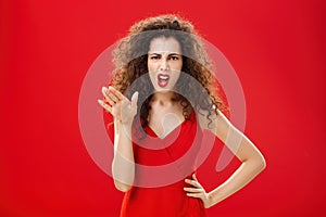 Girl chowing her temper to employees being fed up with unappropriate behaviour complaining standing pissed and