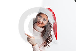 Girl in Christmas hat holding poster