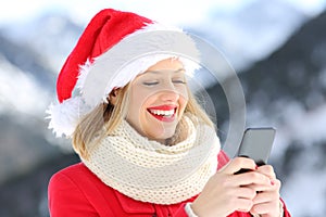 Girl on christmas holidays using smart phone