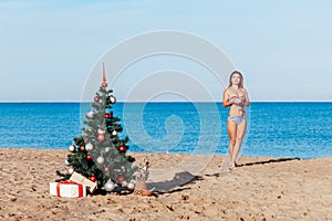 Girl on Christmas vacation on a beach resort