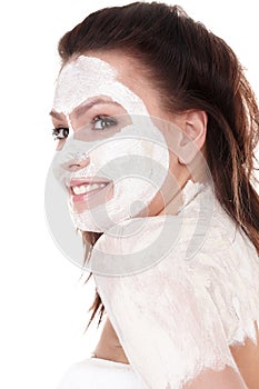Girl with clay facial mask.
