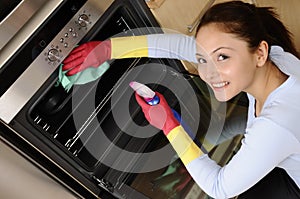 Girl cleaning the house photo