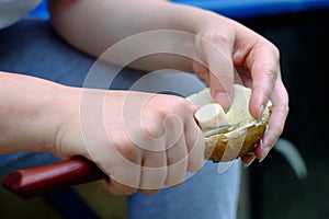 The girl is cleaning mushrooms. Close up view