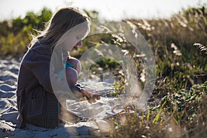 Girl Cleaning Sand Shoes