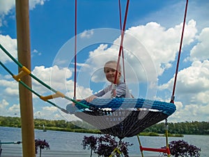 Girl climbing in adventure rope park