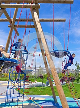 Girl climbing in adventure rope park