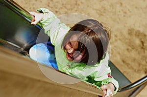 Girl climbing chute photo