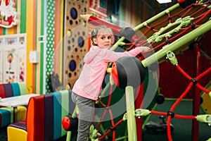 Girl climbing on a ropes, entertainment center