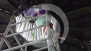 Girl climbing up the ladder on playground