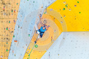 Girl climbing up the wall