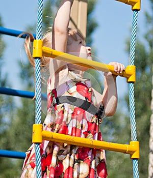 Girl climbs on the ladder