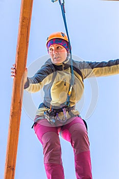 Girl climbs into ropes course