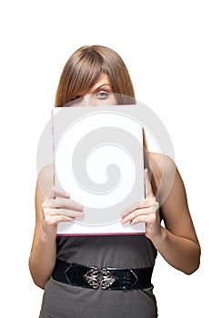Girl close the face of a blank sheet of paper