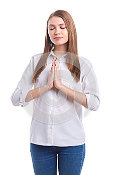 Girl with closed eyes praying on white isolated background