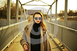 girl in a coat and glasses