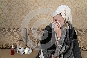 Girl with cold symptoms blows snot into a paper handkerchief