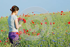 Girl collecting flowers