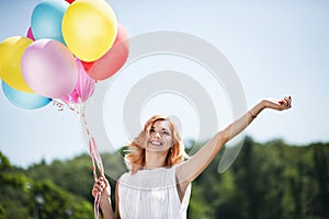 Girl with colorful ballons
