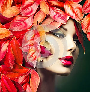 Girl with colourful autumn leaves hairstyle