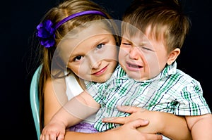 Girl comforting crying baby