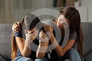 Girl comforting her divorced friend
