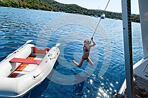 Girl coming ashore from a dingy