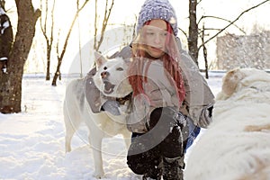 A girl communicates with a dog in nature photo