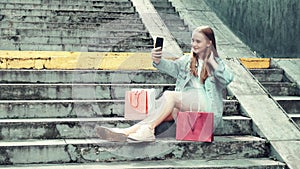 The girl communicates online with friends using video communication.