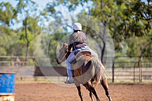 Girl Competing In Barrel Racing At Outback Country Rodeo