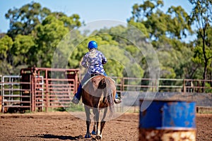 Girl Competing In Barrel Racing At Outback Country Rodeo