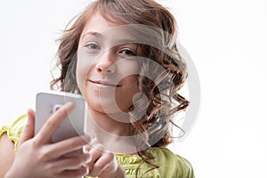 Girl confidently uses smartphone, symbolizes digital natives