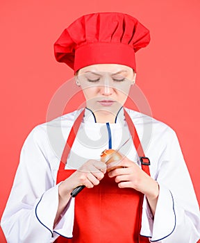 Girl cooking healthy meal. Housewife cook crying while cutting onion. Slice and chop onion. Suffer but keep doing