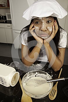 Girl with cooking mess.