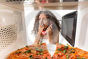 Girl cooking a pizza