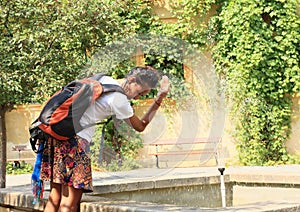 Girl cooling in fountain