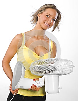 Girl cooling herself with fan