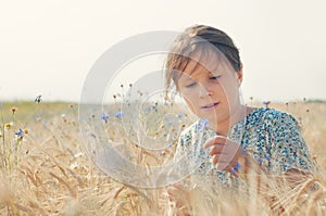 Girl with a cornflower